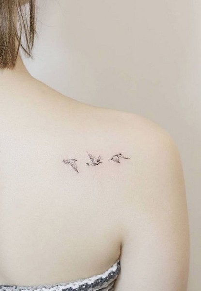 bird tattoo girl