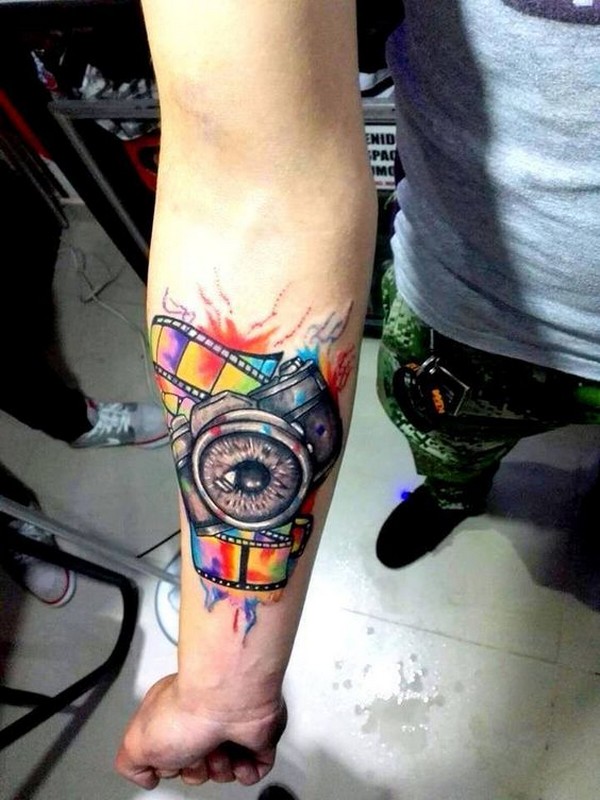 camera tattoo hand
