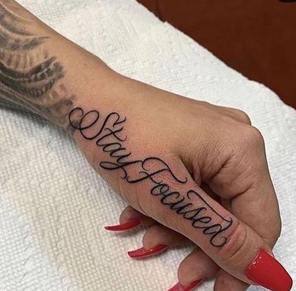 finger tattoo word