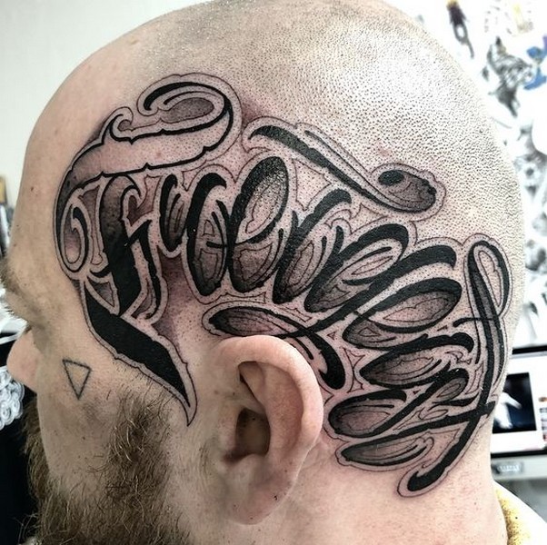 head tattoo black word
