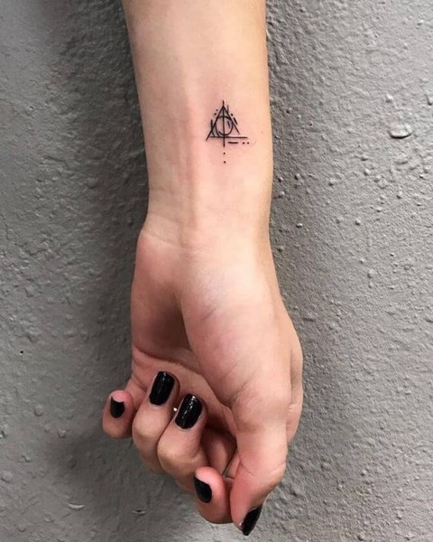 triangle tattoo hand