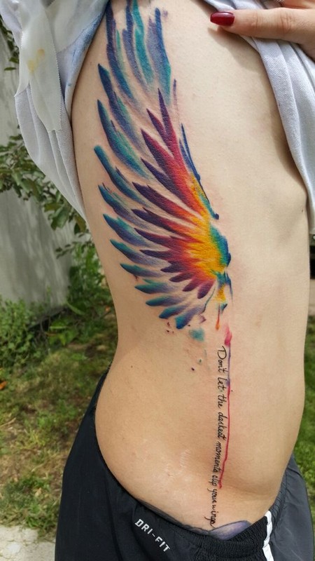 wing watercolor tattoo in side