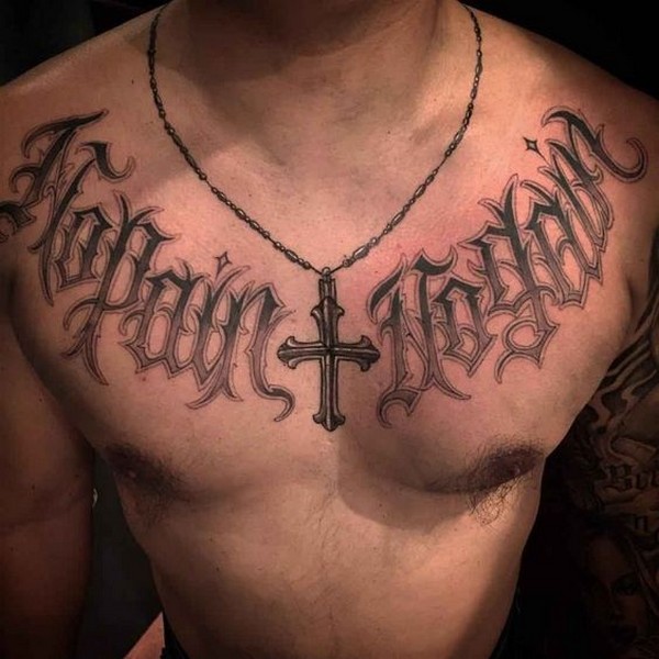 word cross chest tattoo