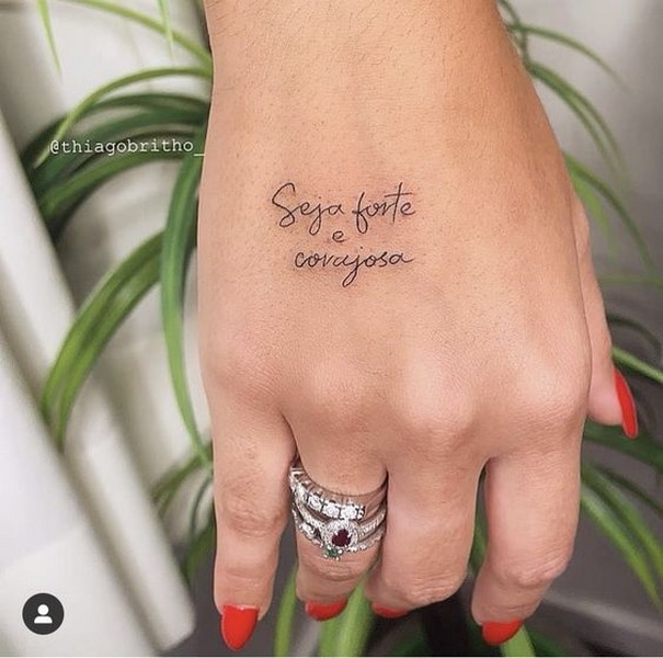 word tattoo hand